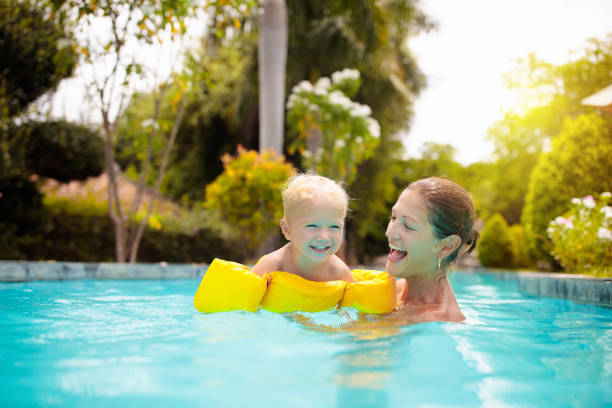 istock Mother and baby in swimming pool 2151648254
