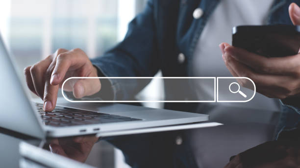 istock SEO, Search Engine Optimization. Woman typing on laptop computer keyboard searching the information, internet browsing. Web page banner, data search technology 2151650733