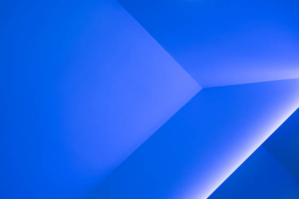 Modern interior walls, backgrounds, studio and product display backdrops. There are shadows from blue and white. Background for text insertion and product presentation