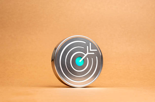 Target dart icon on circle chrome badge on brown recycled paper background, minimal style. Business strategy, action plan and future innovation technology with goal and success concepts.