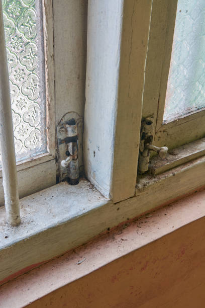 istock old windows with tower bolt hinge and lock close-up 2151653332