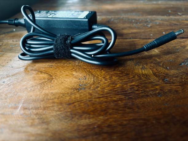 rolled up laptop charger cable