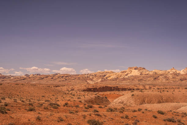 istock Orange Hazy Bluish Purple Sky Desert Area 2151656796