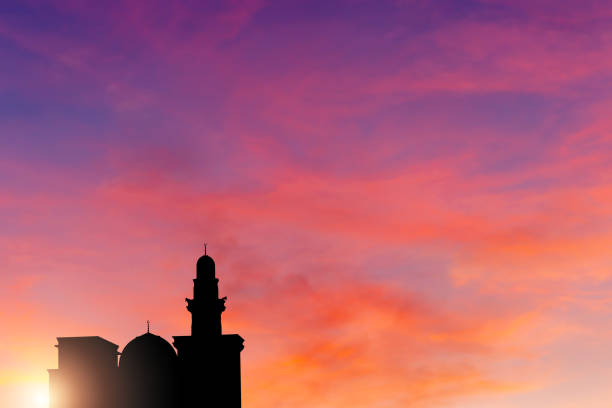 istock The silhouette of a mosque in sunset blurred background 2151656911