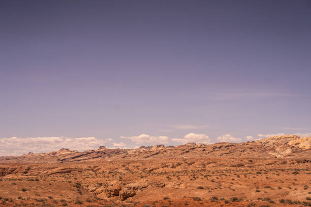 istock Orange Hazy Bluish Purple Sky Desert Area Setting 2151657032