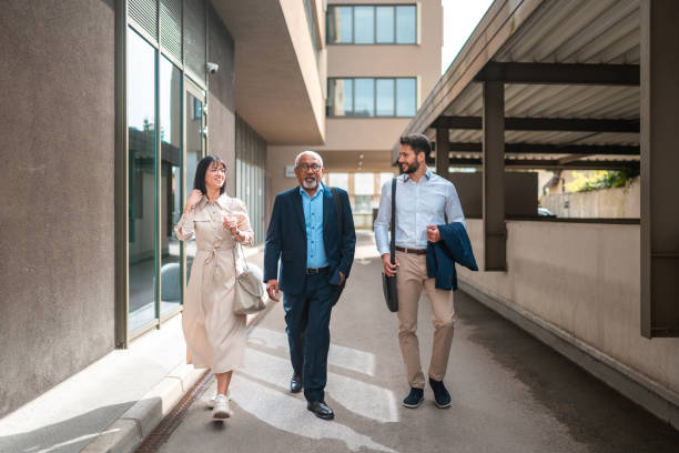 istock Diverse Business Professionals Walking in Urban Setting 2151658476