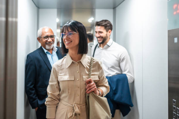 istock Diverse Group of Business Professionals in Elevator 2151658480