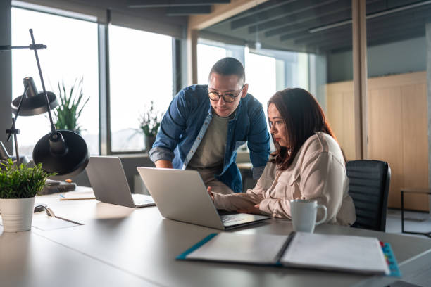 istock Professional Hispanic Team Collaborating in Modern Office 2151658591