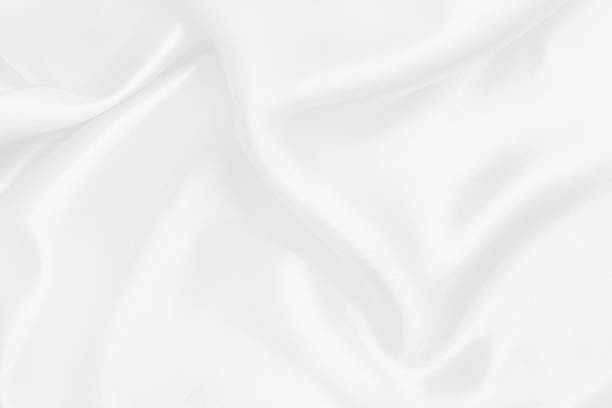 istock White fabric texture background, detail of silk or linen pattern. 2151659396