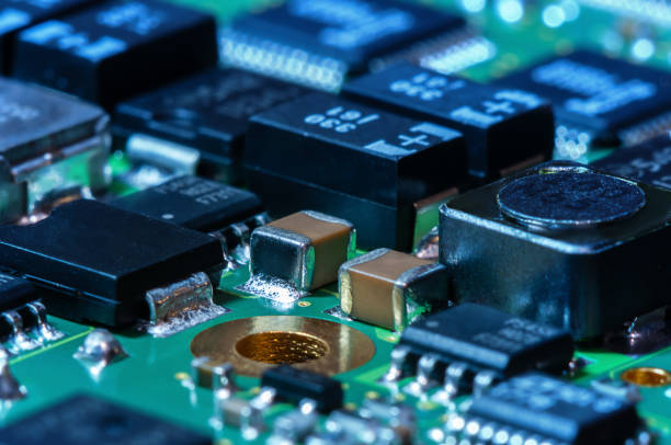 istock Closeup of Printed Circuit Board with processor, integrated circuits and many other surface mounted passive electrical components. 2151659443