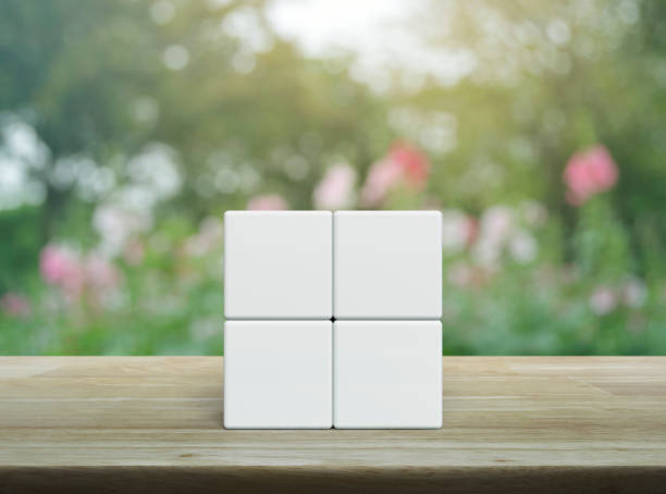 istock Four white block cubes on wooden table 2151661942