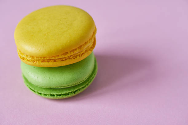 istock Colorful macaroons on pink background, close-up. 2151663071