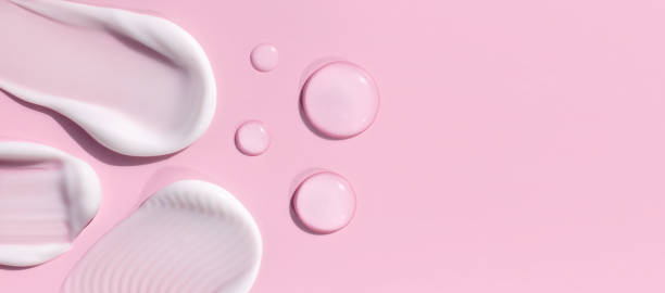 istock composition of smears of cream texture on a pink background 2151663642