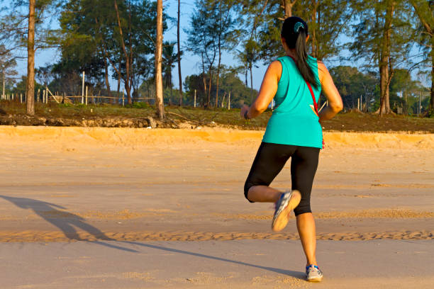 istock Woman exercise morning at beach Bang Boet 2151665214