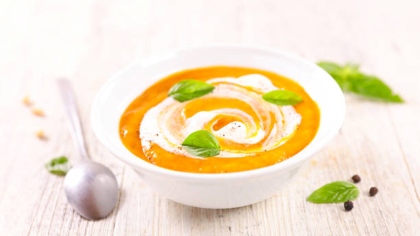 istock bowl of pumpkin soup with cream 2151666808