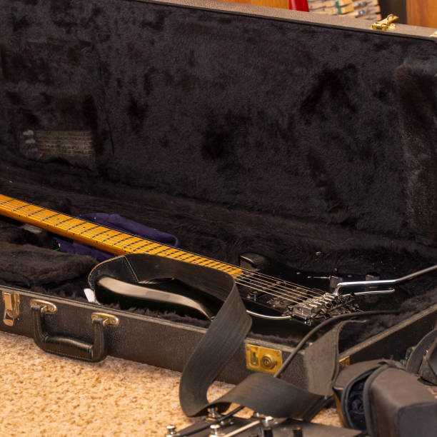 istock Black guitar with tremolo in hard case 2151668836