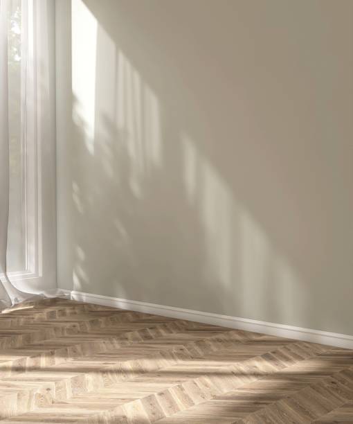 istock Empty beige wall room in sunlight from window, white sheer curtain ,tree shadow on baseboard, herringbone parquet floor 2151670228