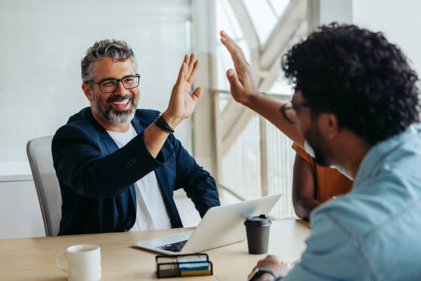 istock Successful business collaboration between two professional male colleagues in a startup office 2151670396