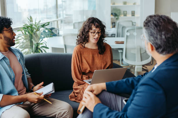 istock Business professionals brainstorming ideas for a creative project in a modern office 2151671298