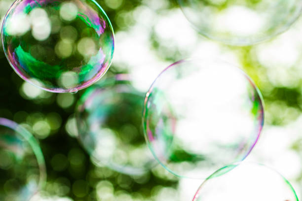 istock soap bubbles close-up on a background of sun and greenery, abstract background, positive mood, holiday, carelessness 2151674113