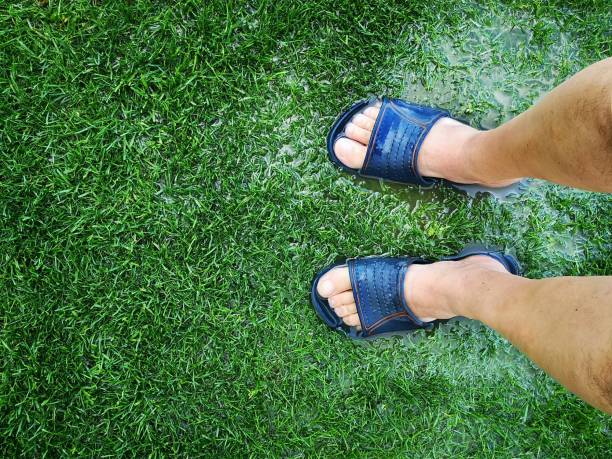 istock Flip flops in the rain 2151675059