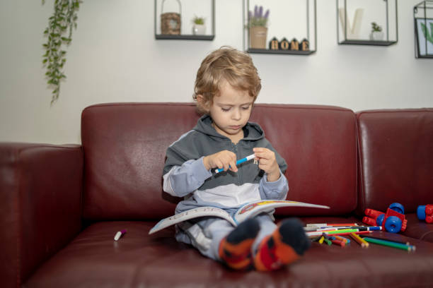istock Little boy painting 2151675654
