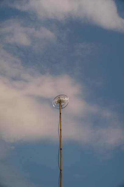 istock Round television antenna against a blue sky 2151679048