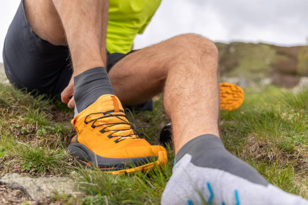 istock Hiker Securing Orange Hiking Boot Outdoors 2151680382