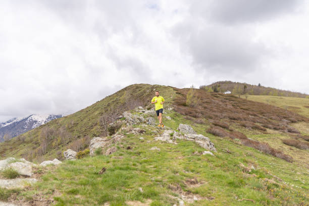istock Hiker Jogging on a Mountain Trail 2151680550