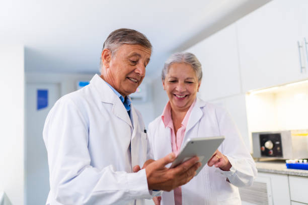 istock Two Doctors Discussing Medical Information on Tablet 2151681331