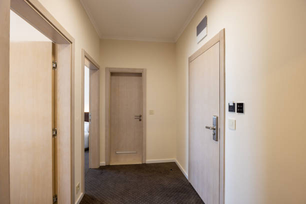 Interior of a carpeted hotel corridor doorway