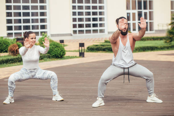 istock Karate group making shot show-performance on a squre before fitness centre 2151684645