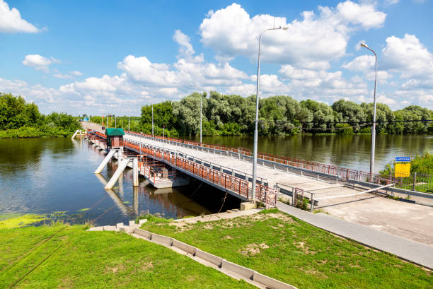 Kolomna, Russia - July 17, 2023: Bobrenevsky pontoon bridge on Moskva River in Kolomna on sunny summer day. Movable Floating Bridge through Moscow River