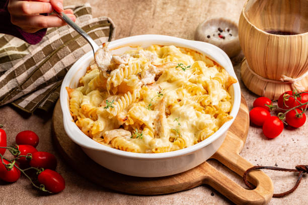 istock Eating oven baked chicken pasta with cheese 2151685834