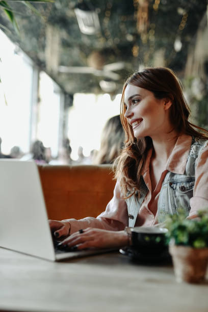 istock Beautiful Female Metadata Specialist Writing Her Best Work While Enjoying Coffee In Bar 2151686270