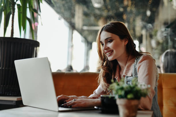 istock Smiling Female Content Writer Feeling Inspired During Coffee Time In Bar 2151686327