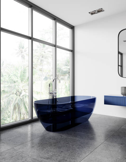istock Stylish hotel bathroom interior with bathtub, sink and panoramic window 2151686973
