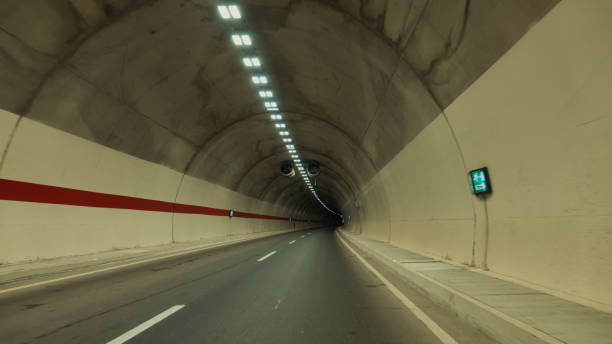 istock Underground tunnel with light and shadow on the surface of the road 2151687035