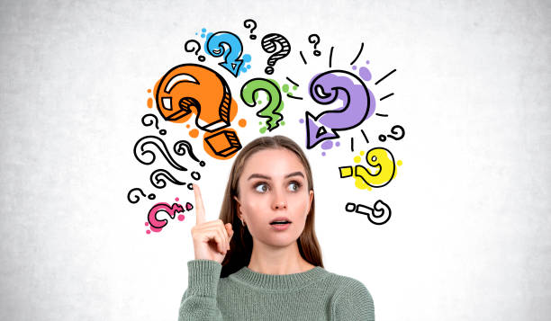 istock Woman pointing up and question marks 2151688380