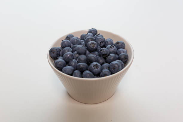 istock Blueberries isolated on white background, close-up, front view, top view, 2151691878
