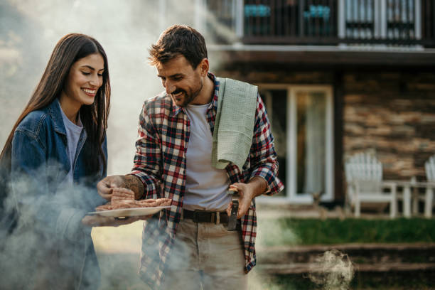 istock Young couple preparing barbecue 2151692184