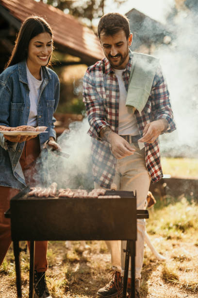 istock Beautiful woman and handsome man having barbecue 2151692252