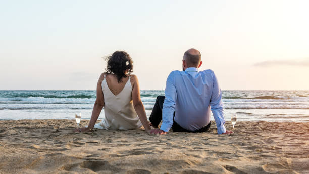 istock Romantic Couple Enjoying Beach Sunset with Wine 2151693997