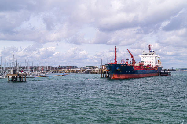 Nautical Vessel on Cardiff Bay in Wales, UK, with commercial signs in the background.