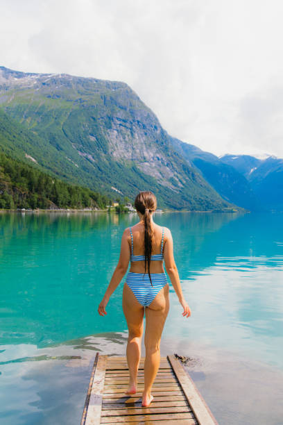 istock Woman at Crystal Blue Mountain Lake 2151695374