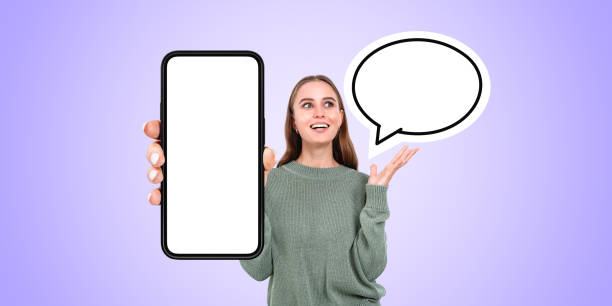 istock Young woman showing phone with blank screen and speech bubble 2151696259