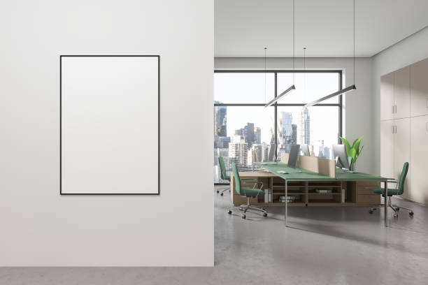istock White and green open space office interior with poster 2151696669
