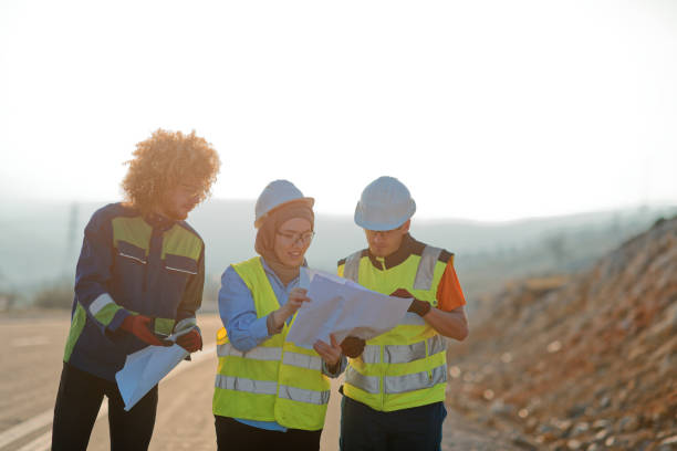 istock A team of engineers and workers oversees a wind turbine project at a modern wind farm, working together to ensure the efficient generation of renewable energy 2151697517