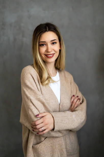 istock Young woman psychologist smiling confident against a grey background 2151697626