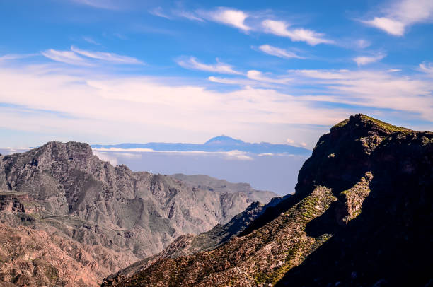 istock The sky is blue and the mountains are covered in clouds 2151698998